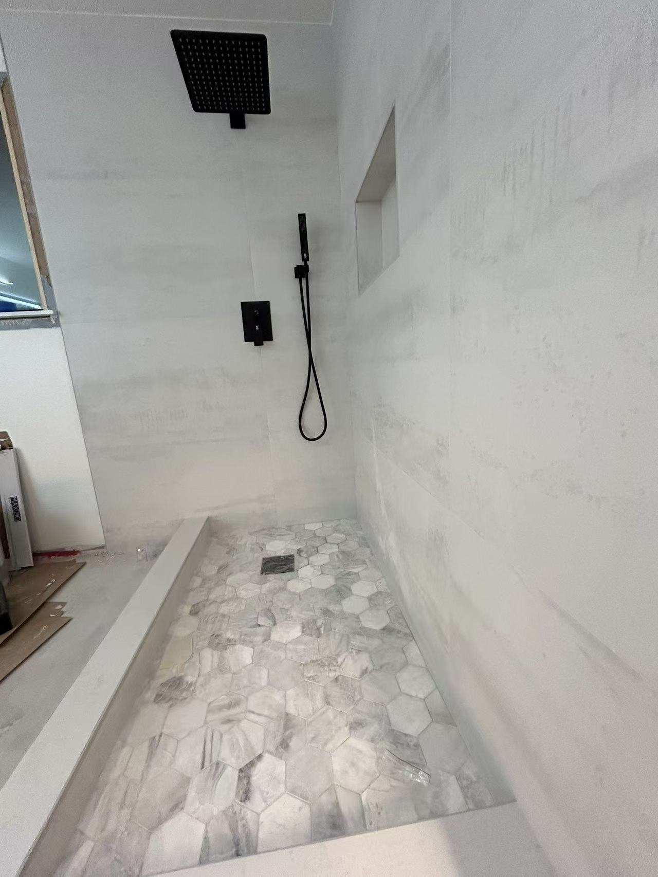Bellevue spa bath stage 7 — frameless glass walk-in shower detail