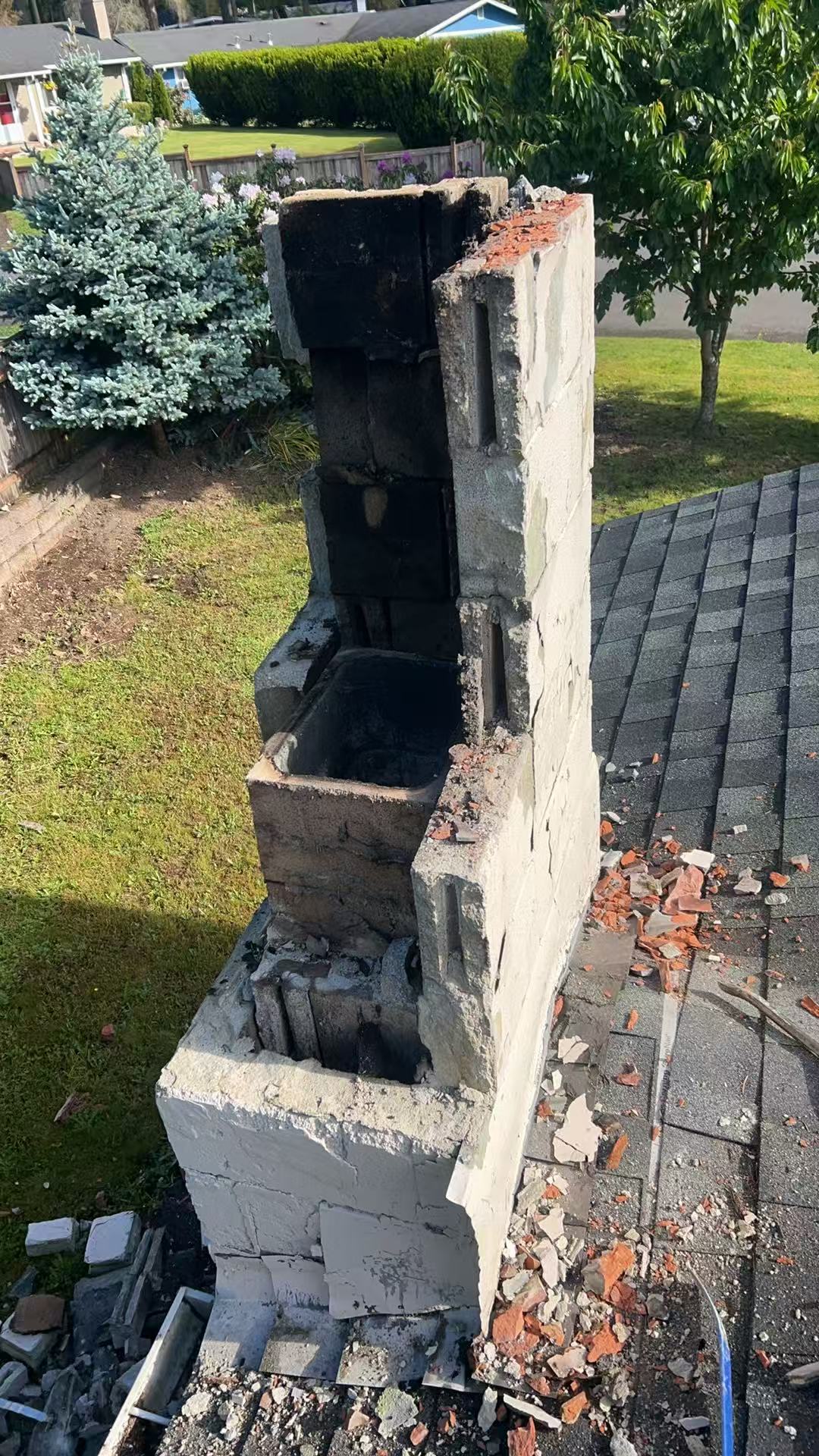 Bothell exterior renovation — before, damaged chimney and worn siding