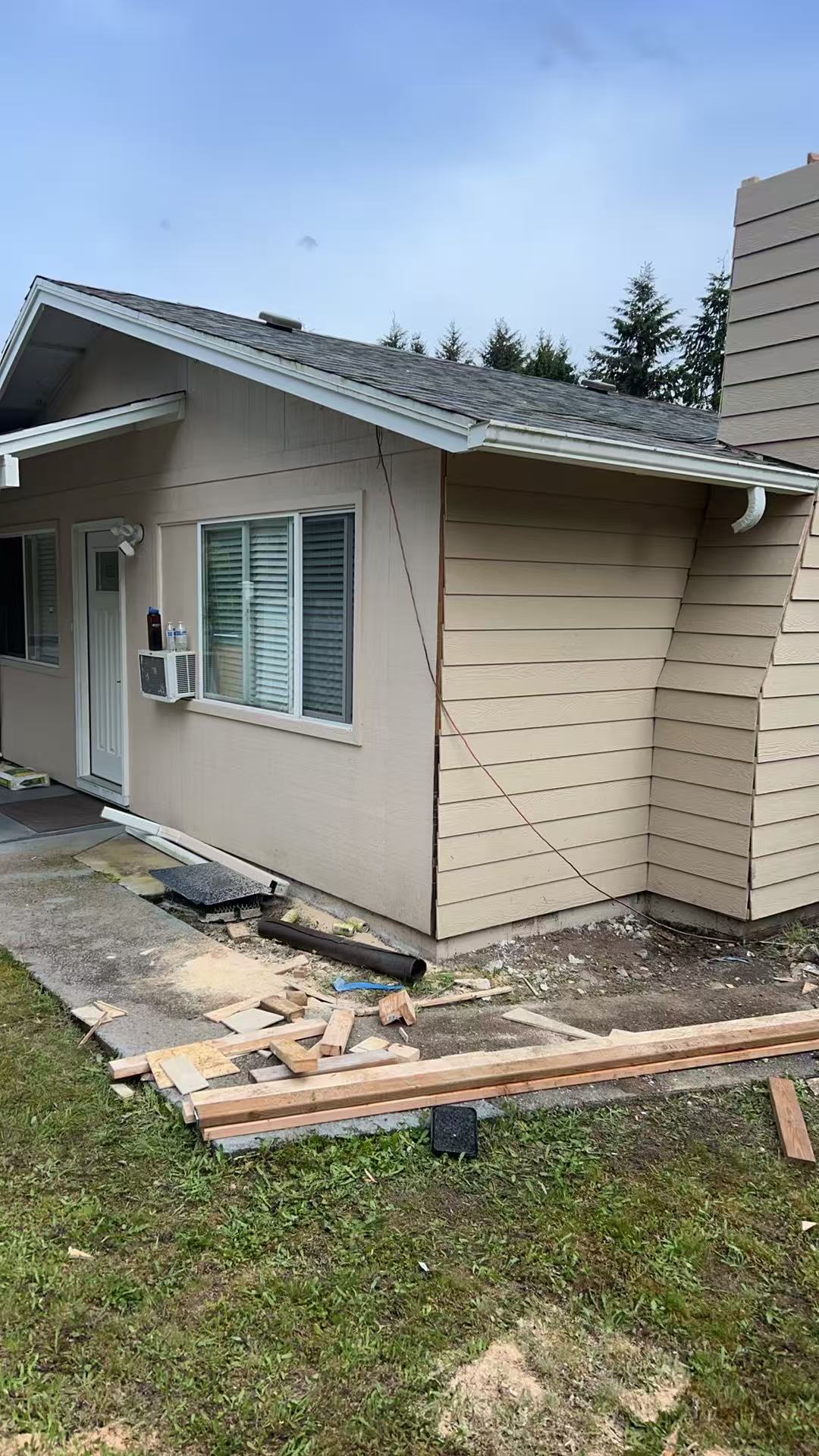 Bothell exterior stage 4 — damaged siding patched and lapped