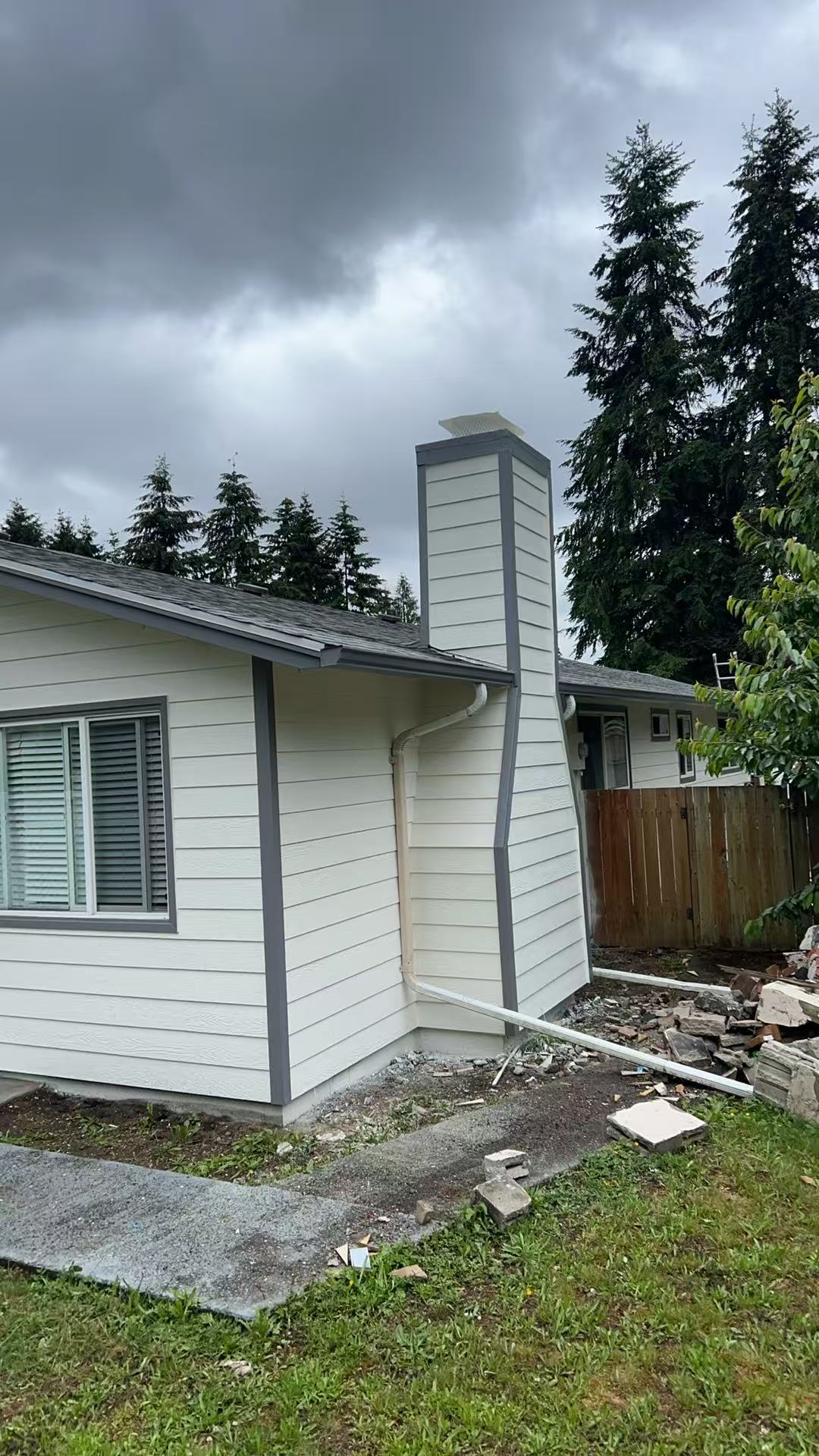 Bothell exterior stage 7 — finished chimney and trim detail